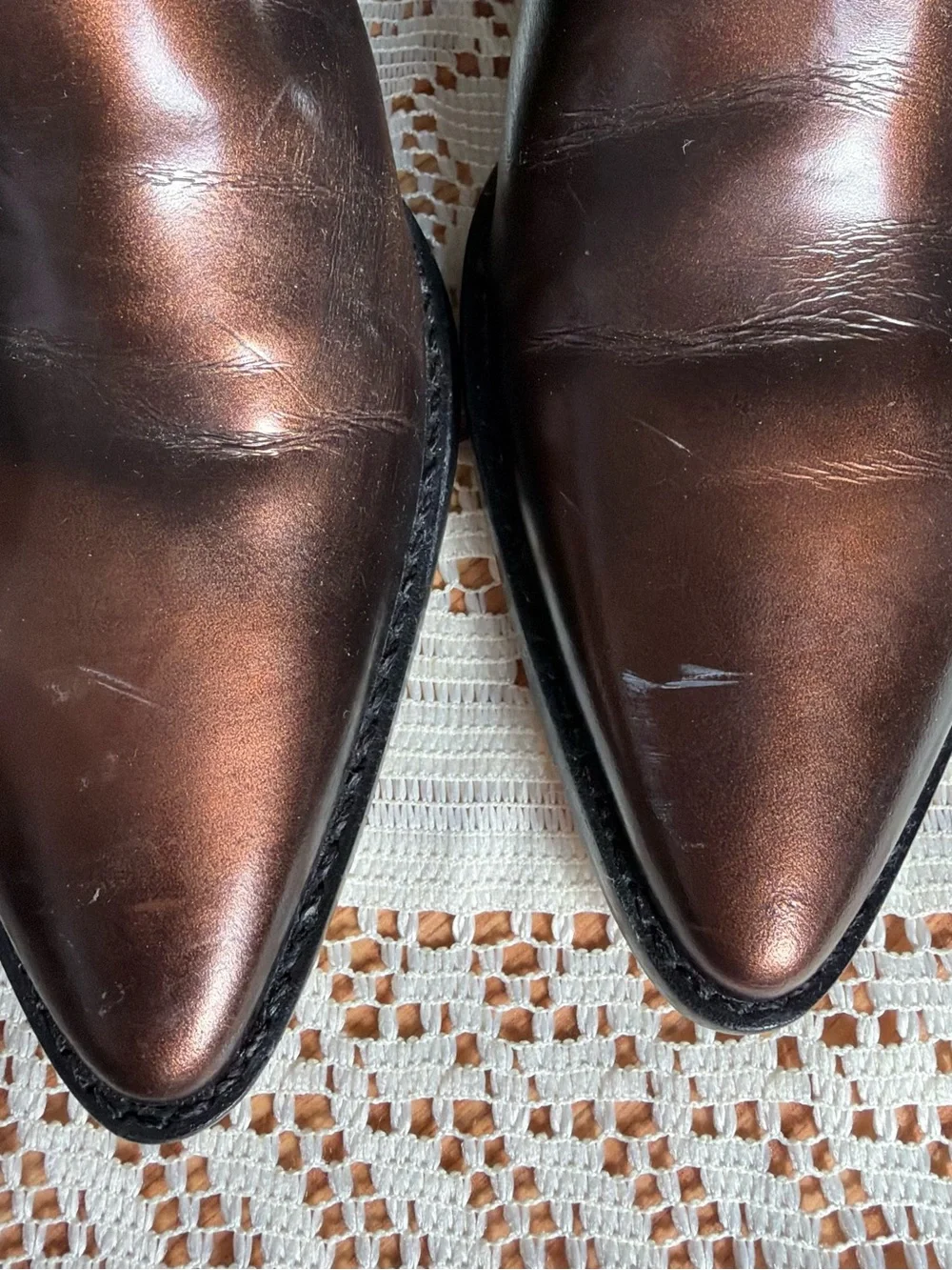 Brown leather boots with a pointed toe